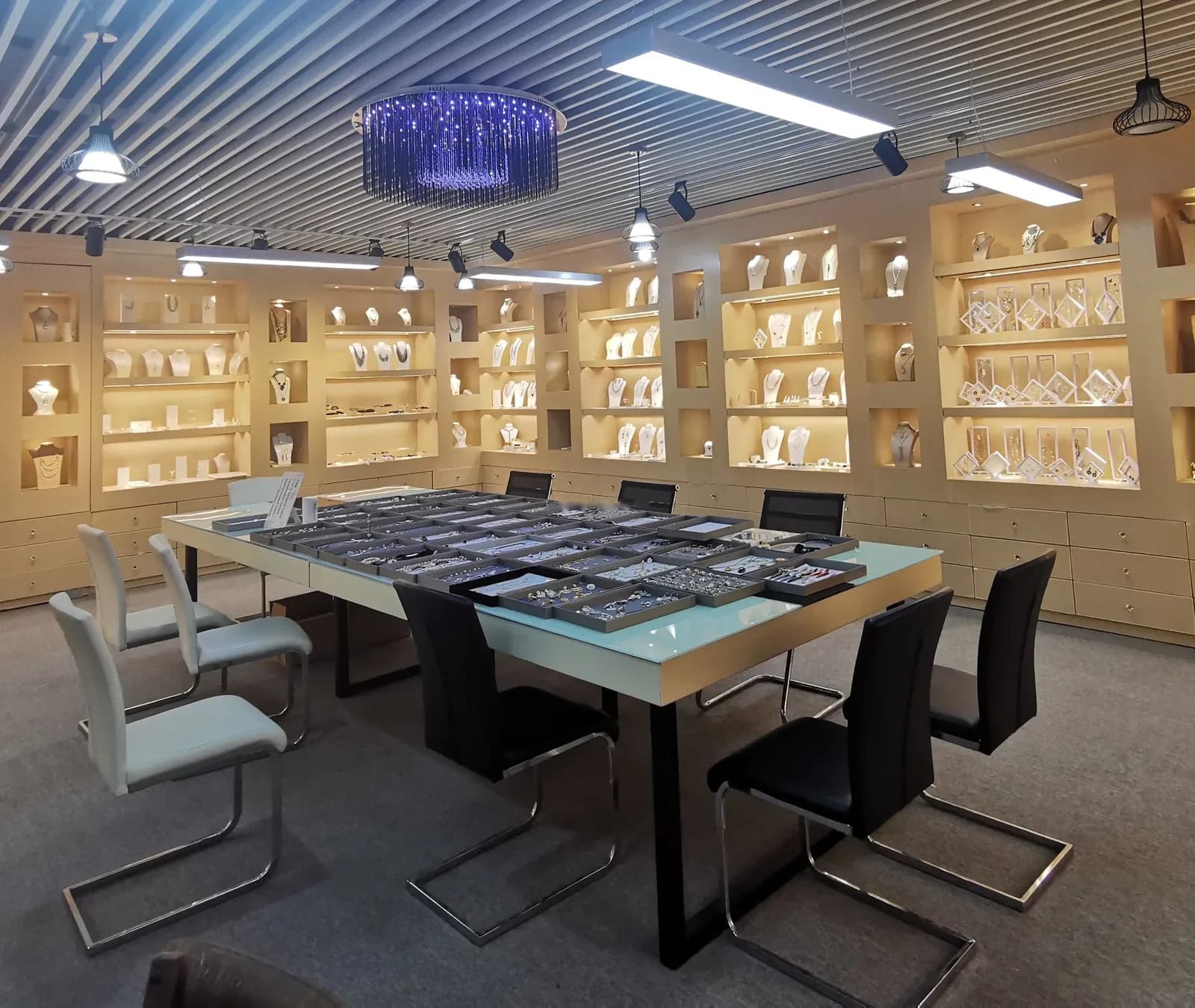 JY-Jewellery showroom with trays of fashion jewellery samples.