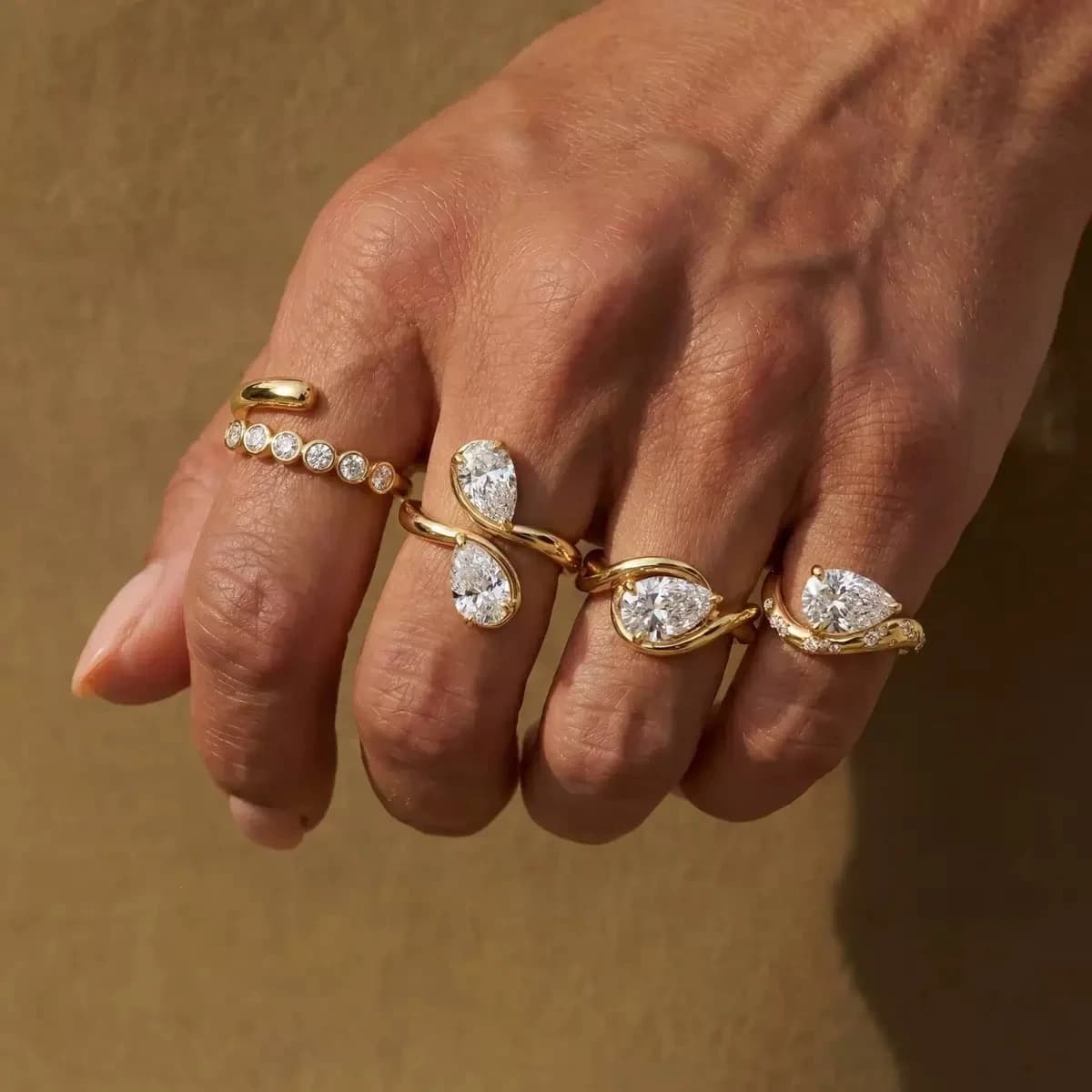 Gold fashion rings with pear-cut stones, photographed for JY-Jewellery.