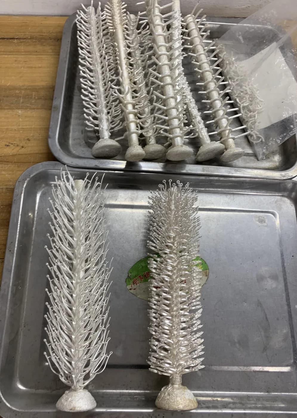 Wax and metal casting trees of jewellery components in the factory.
